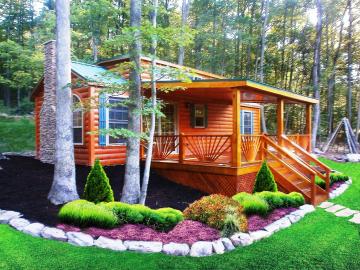 cabin with beautiful landscaping