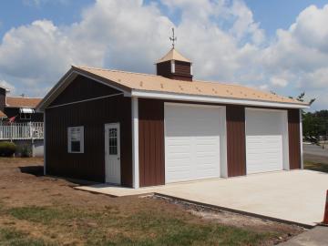 Brown siding, Tan Roof, White doors